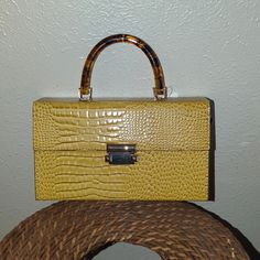 Est 1949. Mustard Mini Tote. Brwn Marble Handle With Log Strap ( Removable) Gold Box Bag With Gold-tone Hardware Tote, Brown Rectangular Bag With Gold-tone Hardware, Brown Square Bag With Gold-tone Hardware, Brown Rectangular Box Bag With Gold-tone Hardware, Orange Tote Shoulder Bag With Gold-tone Hardware, Mini Tote, Brown Gold, Mustard, Mini Bag