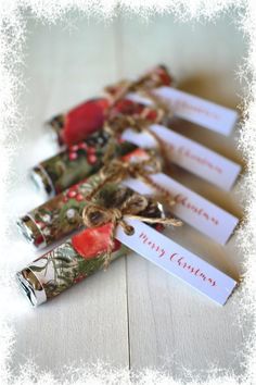 christmas crackers wrapped in twine and tied with ribbon