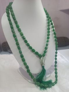 108 Beads AAA 968 Carat Emerald Dyed Japa Mala Prayer Green Color Oval Beads Japa Mala Guru bead Necklace // Long Tassel Necklace// Meditation japa mala // Guru bead// Necklace Yoga Beads Stone - Emerald Dyed Shape - Oval Size - Approx - 10x12mm Colour - Green It is known as the 'love stone' as the message it emits is the strong vibration of unconditional love, joy, warmth and healing. As quartz crystals are profound amplifiers of energy, it may help to kindle happiness, love, romantic feelings Spiritual Style Faceted Round Beaded Necklaces, Spiritual Style Round Faceted Beads Necklace, Green Gemstone Beads Mala For Healing, Spiritual Beaded Necklace With Faceted Oval Beads, Spiritual Beaded Necklaces With Faceted Oval Beads, Handmade Jade Beaded Necklaces, Handmade Oval Spiritual Beaded Necklaces, Green Beaded Mala For Healing, Green Polished Beads Mala As Gift