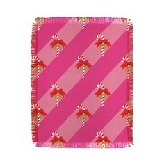 a pink and red christmas scarf with candy canes on it