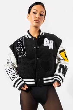 The azalea wang keep it classic patch varsity jacket features a felted knit base, faux leather long sleeves, and textured varsity patches throughout. patchwork detailing reads “tokyo,” across the back, “aw,” at the chest, "2002," "a," "ny," and "u," along the sleeves. complete with slant side pockets, a quilted inner lining, elastic striped hems, and a snap button up front closure.  - 92% polyester 6% viscose 2% polyester  - hand wash cold - 18” shoulder t Collegiate Letter Print Outerwear For Fall, Collegiate Fall Outerwear With Letter Print, Varsity Long Sleeve Outerwear For Streetwear, Trendy Winter Varsity Sports Jacket, Black Varsity Jacket With Embroidered Patch For Fall, Collegiate Outerwear For Fall Streetwear, Trendy Long Sleeve Varsity Jacket For Streetwear, Trendy Winter Varsity Jacket For Streetwear, Trendy College Outerwear With Baseball Collar