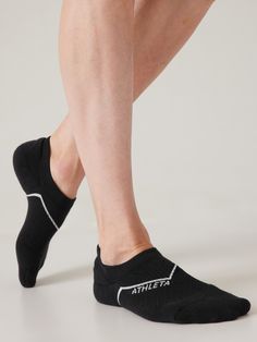 a woman's legs with black athletic socks