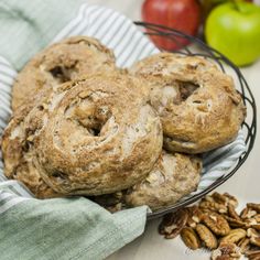 apples, pecans and cinnamon rolls in a basket