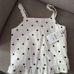 Nwt Polka Dot Zara Girl’s Top With Ruffles On The Bottom. 100% Cotton, Linen Like Cute Polka Dot Sleeveless Top, Cute Polka Dot Top For Spring, Cute Spring Polka Dot Tops, Spring Polka Dot Cotton Tops, Polka Dot Sleeveless Cotton Top, Sleeveless Polka Dot Cotton Tops, Sleeveless Polka-dotted Cotton Top, Cute Zara Cotton Tops, Trendy Polka Dot Cotton Tops