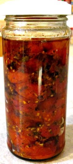 a glass jar filled with food sitting on top of a table