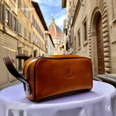 Introducing our Handmade Italian Leather Toiletry Unisex, the perfect travel companion. Crafted with care in Florence, this toiletry bag is made from high-quality leather and features a spacious interior with multiple compartments for easy organization. Its unisex design makes it a versatile and stylish accessory for any traveler. . Size: Width:26cm/10.4 Inch Height:15cm/5.9Inch Depth:12cm/4.8Inch . The story about this handmade toiletry: Once upon a time, there was a man named Marco who loved to travel. He was always on the lookout for the perfect toiletry bag to hold his grooming essentials. One day, he stumbled upon a beautiful leather dopp kit handmade in Florence. The bag was made with the finest Italian leather and had a unique quilted design. It also had a leather tray inside to kee Make Up Kits, Leather Dopp Kit, Mens Toiletry Bag, Leather Tray, Travel Cases, Leather Toiletry Bag, Vanity Bag, Vanity Case, Dopp Kit