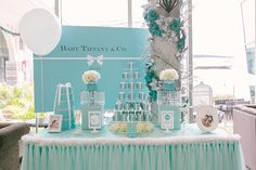 a baby shower party with blue and white decorations