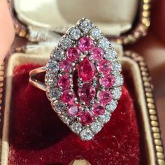 When ordering, please give us your phone number for safer Fedex shipping!RING SIZE: 7 US, 55 EU 14K GOLD WEIGHT: 9.15 grams STONES: ruby, diamonds RUBY: authentic, 1.60 ct. TOTAL DIAMOND WEIGHT: 0.80 ct. COLOUR: H CLARITY: Vsi CONDITION: EXCELLENT This stunning ring features a marquise-shaped cluster of rubies and diamonds, set in 14k gold. The ring dates back to the 1960s, a decade of glamour and elegance. The rubies are rich and vibrant, while the diamonds sparkle with brilliance.  The ring we Luxury Ruby Cluster Ring, Cluster Ruby Ring With Diamonds, Luxury Red Marquise Cut Ruby Ring, Luxury Marquise Cut Red Ruby Ring, Marquise Ruby Ring With Diamonds, Marquise Ruby Diamond Ring, Cluster Ruby Ring With Center Stone, Ruby Cluster Diamond Ring, Marquise Ruby Rings With Brilliant Cut