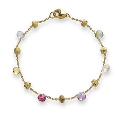 Crafted from 18k yellow gold and featuring a variety of colorful gemstones, this Paradise Collection single strand bracelet is a stunning statement piece. Marco Bicego Jewelry, Different Gemstones, Colorful Gemstones, Marco Bicego, The Paradise, Strand Bracelet, Gemstone Colors, Jewelry Pieces, Wedding Bands