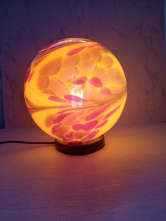 a colorful lamp sitting on top of a table