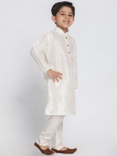 VASTRAMAY Boys' Cream Cotton Silk Blend Kurta and Pyjama Set Look stylish and comfortable in this cream colored kurta pyjama set from VASTRAMAY. Made from a blend of cotton and silk, this set is perfect for any occasion. Features Cream color Cotton and silk blend fabric Kurta with a mandarin collar and button closure Pyjama with drawstring closure Specifications Sleeve Length - Long Sleeves Top Shape - Straight Top Hemline - Straight Top Length Above Knee Length Neck Mandarin Collar Material & C Traditional Festive Loungewear Sets, Festive Traditional Loungewear Set, Festive Long Sleeve Loungewear Pant Set, Festive Long Sleeve Loungewear Sets, Traditional Beige Long Sleeve Sets, Off White Long Sleeve Set For Diwali, Long Sleeve Off White Set For Diwali, Traditional White Sleepwear, Traditional White Sleepwear For Loungewear