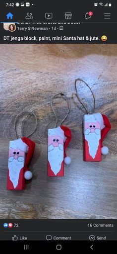 three paper santa claus ornaments hanging from strings on a wooden table with text that reads, diy jenny block, lint, mini santa hat & jite