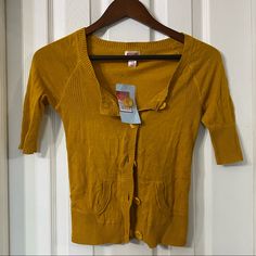 Brand New, With Tags. Mustard Yellow Three Quarter Length Sleeve Cardigan With Pockets. Size Xs, By Mossimo. Casual Yellow Cotton Cardigan, Yellow Fitted V-neck Cardigan, Casual Mustard Cardigan For Spring, Yellow Fitted Casual Cardigan, Yellow Fitted Trendy Cardigan, Fitted Yellow Casual Cardigan, Fitted Yellow Cardigan For Fall, Yellow Cotton V-neck Sweater, Mustard Yellow Cardigan