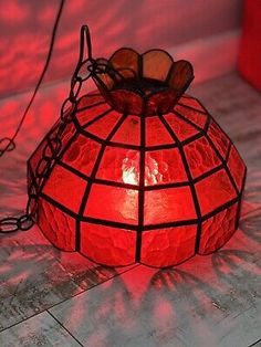 a red lantern is sitting on the floor