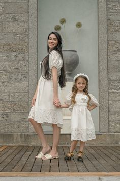 Get your little one ready for any occasion with the Blanca White Cotton Dress. Made with soft and lightweight cotton, this girls' dress is perfect for a day out in the sun or a special event. The crisp white color and playful design will make your child stand out in style. Eyelet Embroidered Trimming Lace Puff Sleeves Adjustable Eyelet Bow on Back Handmade Flower Tassels Peasant shape bodice Lightweight and breathable, unlined Falls below the knee and fits true to size Matches our Blanca Collection 100% Cotton Made in Turkey Care Instructions: Machine wash cold, gentle cycle, with mild detergent. Hang to dry. Iron or dry clean for best look, Avoid ironing the lace. Embroidered Cotton Dresses For Baptism, White Floral Embroidered Baptism Dress, Peasant Bodice, White Folk Dress With Embroidered Hem, White Embroidered Baptism Dress, Flower Tassels, Embroidered Cotton Baptism Dress, White Cotton Dress, Mom Dress