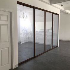 an empty room with sliding glass doors in it