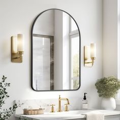 a bathroom sink with a mirror above it and a vase on the counter next to it