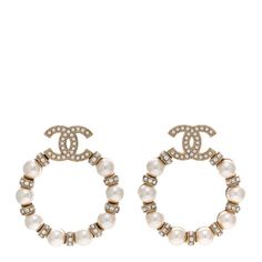 This is an authentic CHANEL Pearl Crystal Nefertiti CC Drop Earrings in Gold. These stylish hoop earrings feature a gold crystal and faux pearl-encrusted hoop with a CC logo hanging in the center. Chanel Jewellery, Chanel Pearl, Chanel Pearls, Drop Earrings Gold, Chanel Earrings, Chanel Jewelry, Pearl Crystal, Earrings In Gold, Gold Crystal