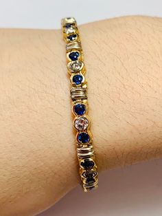 Stunning Vintage 14K Yellow Gold Diamond Sapphire Bracelet: Stunning Genuine Diamonds and Natural Sapphires Sapphire(s): 3.05 CT Diamond(s): 2.15 CT Color: F Clarity: SI1 Total Bracelet Weight: 14.1 GR Bracelet Length: 7in Bracelet Width: 1/2cm 14K Yellow Gold For more information regarding this item feel free to reach me so I can accommodate your needs. Thank you Exquisite Gold Tennis Bracelet For Anniversary, 14k Gold Tennis Bracelet With Gemstones For Formal Occasions, Formal Gold Diamond Bracelet With Gemstone, Gold Diamond Bracelet With Gemstone For Formal Occasions, Exquisite Gold Tennis Bracelet For Formal Occasions, Exquisite Gold Tennis Bracelet For Formal Events, Blue Gold Bracelet With 17 Jewels For Formal Occasions, Elegant Aaa Quality Tennis Bracelet For Anniversary, Gold Diamond Tennis Bracelet With Gemstones