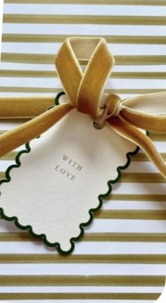 a gift card with a ribbon tied around it and the words with love written on it