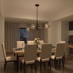 a dining room table and chairs in front of a window