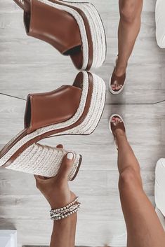 Fan of the sunshine? Yes. Fan of these platforms? Big time. These are the perfect Spring/Summer heel! Tall braided woven platforms, leather strap on top of the foot, open toe, slip on style, comes in tan, black, and white Runs true to size Heel height is 6" Summer Heels, Amazing Lace, Native Style, Big Time, Brown Sandals, The Sunshine, Platform Sandals, Open Toe, Black And Brown