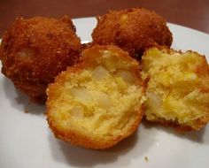 three fried food items on a white plate