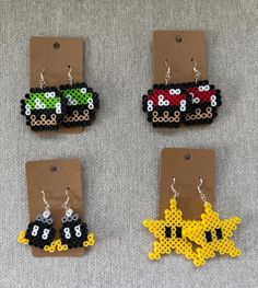 four pieces of beaded earrings with cars on them