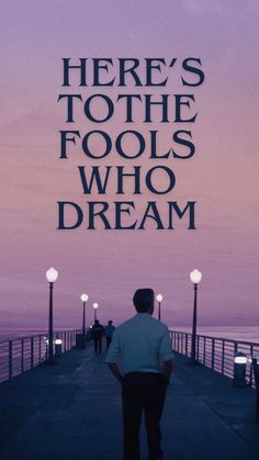 there's to the fools who dream poster with man standing on pier at dusk