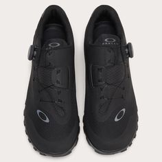 a pair of black sneakers with laces on the side and one shoelaced