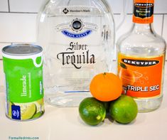 the ingredients to make an alcoholic drink including limeade, ginger syrup, and vodka