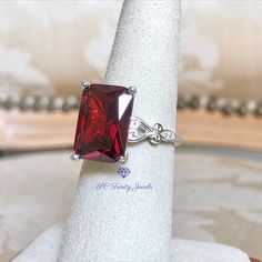 Bold & Beautiful is the best way to described this amazing vintage style cathedral Ruby Ring. Designed with 6 lab grown pinpoint Diamonds which makes this ring look elegant, capturing everyone's attention. You are sure to receive inquiries on this beauty. Your ring will arrive in a Veltex gift ring box inside an outer carton box. RING SPECIFICS: Material: Sterling Silver Setting Shape: Emerald Cut Setting Type: 4 Prong Setting Size: 14x10mm Approx. Shank Base Width: 1.9mm Approx. Shank Base Classic Emerald Cut Lab-created Ruby Ring, Emerald Cut Lab-created Ruby Rings In White Gold, Classic Emerald-cut Ruby Ring With Polished Finish, Luxury Emerald-cut Lab-created Ruby Jewelry, Tapered Engagement Ring, Luxury Emerald-cut Ruby Ring In Sterling Silver, Cathedral Ring, Cathedral Engagement Rings, Box Ring