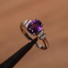 It is natural amethyst ring, the main stone is about 7mm*9mm, oval cut, weight about 1.77 carats.The basic metal is sterling silver and plated with rhodium.To change the metal to a solid gold (white/rose) or platinum is also available, please ask for a quotation if you want.You can also go to my shop Home for more elegant rings: https://www.etsy.com/shop/godjewelry?ref=hdr_shop_menuAmethyst is February birthstone.More amethyst rings:https://www.etsy.com/shop/godjewelry?ref=seller-platform-mcnav& Elegant Amethyst Oval Cabochon Ring, Elegant Oval Cabochon Amethyst Rings, Elegant Sterling Silver Amethyst Ring Oval Cabochon, Silver Oval Solitaire Amethyst Ring, Silver Solitaire Oval Amethyst Ring, Silver Amethyst Ring With Oval Cabochon, White Gold Oval Amethyst Solitaire Ring, Oval White Gold Amethyst Solitaire Ring, Oval White Gold Solitaire Amethyst Ring