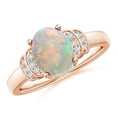 an opal and diamond ring in yellow gold