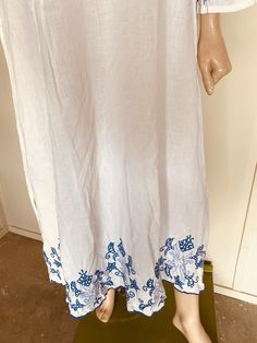 "I love this!! White cotton Blue embroidery Great condition Super light fabric Circa 1970's Measures: 36\" across chest 14\" shoulder to shoulder Hips 44\" Length 52\"" Beach Floral Embroidered Maxi Sundress, Floral Embroidered Sundress Maxi Dress For Vacation, Beach Sundress With Floral Embroidery, Floral Embroidery Maxi Dress For Summer Beach, Floral Embroidered Maxi Dress For Summer Beach, Summer Beach Maxi Dress With Floral Embroidery, Spring Embroidered Beachwear Maxi Dress, Casual Embroidered Dresses For Beach Season, Casual Floral Embroidered Maxi Dress For Beach