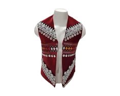 ~ Step into the cultural beauty of Afghanistan with our Afghan Traditional Velvet Waistcoat.  Created by Afghan women, each waistcoat is made with care, featuring a beautiful maroon velvet and a unique patchwork design that shows off Central Asian traditions.  This waistcoat is for everyone, adding a touch of tribal patterns and boho style to any occasion. Wear this handmade treasure to celebrate Afghan culture and show your authentic style!  PLEASE NOTE: Each waistcoat is 100% customized and ta Traditional Red Vest For Festival, Traditional Sleeveless Vest For Festive Occasions, Traditional Sleeveless Festive Vest, Red Embroidered Sleeveless Vest, Traditional Sleeveless Nehru Jacket For Festivals, Traditional Sleeveless Vest Outerwear, Traditional Sleeveless Vest For Festivals, Traditional Embroidered Sleeveless Outerwear, Traditional Ceremonial Sleeveless Vest