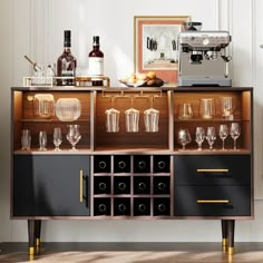 a cabinet with wine glasses and bottles on it in front of a wall mounted coffee maker