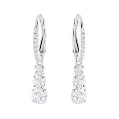 Conceived with the romantic concept that eternal love must have a past, present and future, these stunning Swarovski earrings feature a trio of crystals embelished with a pave scintillating design. Timeless and elegant, they are a treasured keepsake.- Earrings are rhodium plated for a white bright finish- Earrings measure 1 1/8" long- Swarovski's enduring quest for innovation, beauty and excellence is characteristic of their exquisite designs- Free cleaning and inspection at Day's for life of th