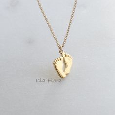 "Celebrate the joy and love of motherhood with this sentimental 18k Gold Dipped Baby Feet Necklace. Crafted with delicate details, this necklace features adorable baby feet charms, symbolizing the precious journey of parenthood and the immeasurable love for your little one. The pendant showcases meticulously crafted baby feet, made from high-quality alloy and dipped in a layer of radiant 18k gold. The intricate design captures the tiny toes and curves, representing the innocence and beauty of a Infant Gold Necklace, Dainty Keepsake Jewelry For Mother's Day, Dainty Hypoallergenic Jewelry For Keepsake, Dainty Hypoallergenic Keepsake Jewelry, Minimalist Keepsake Jewelry For Mother's Day, Feet Necklace, Kids Jewellery, Pregnancy Gifts, Animal Clipart