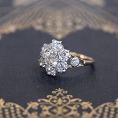 Super charming, super beautiful, and incredibly sparkly antique cluster ring, set wit the chunkiest and most lively old cut diamonds! The central diamond is showcased stunningly well in the surround of chunky old mine cut diamonds. In yellow gold, all the diamonds just pop! Low set on the finger, this ring is ideal for daily wear, and what a stunning and unique engagement ring this would make. Just a classically styled ring from the Victorian era. 14kt yellow gold, size 7.50, and fully sizable. Cluster Ring Set, Antique Diamond, Diamond Cluster Ring, Diamond Cluster, Unique Engagement Rings, Cluster Ring, Victorian Era, Ring Set, Diamond Earrings