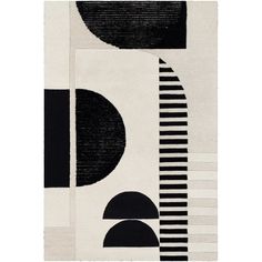 an abstract rug with black and white shapes on the side, along with circles and stripes