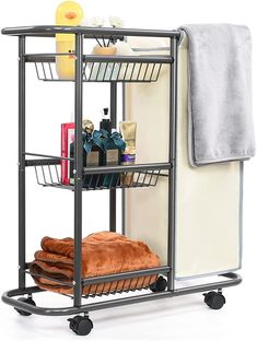 a bathroom shelf with towels, soaps and other items on it's wheels