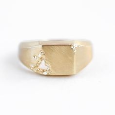 AIDAN RAW SIGNET RING This elegant design is a men's signet ring in gold or platinum. DETAILS  Band width: approx. 9.3mm in the front 3.3mm at the back  Finish: Polished
   Material:14k Gold: yellow, white, rose  18k Gold: yellow, white, rose  Other Metal: platinum  Sizing: We are using US metric system   CUSTOMIZATION OPTIONS This design can be made with gemstones of your choosing. If you would prefer a custom ring, please contact us before purchase. PROCEDURE INFORMATION Please select the material and ring size from the drop-down menu on the right side of the listing.
  SHIPPING INFORMATION Free Insured Shipping: The item will be gift wrapped and shipped with insured express shipping from Europe. Luxury Gold Signet Ring With Tension Setting, Custom Signet Ring, Metric System, Signet Ring Men, Signet Rings, Gold Signet Ring, Custom Ring, Unique Gemstones, Signet Ring