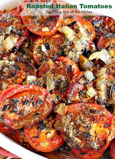 roasted italian tomatoes in a white casserole dish on a red and white tablecloth