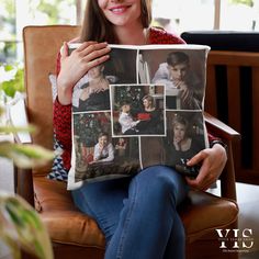 a woman sitting in a chair holding a pillow with photos on it