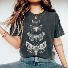 Looking for a shirt that fits your whimsical style? The Comfort Colors Cottage Core Moth Shirt is the perfect addition to your wardrobe! The celestial moth design is the epitome of goblincore and fairycore trends, and the oversized vintage fit adds a touch of comfort to your everyday outfits. Plus, it makes for a great gift idea for your fellow insect-loving friends. 💫T-SHIRT DETAILS Comfort Colors introduces its garment-dyed t-shirt; a fully customizable tee made 100% with ring-spun cotton. The soft-washed, garment-dyed fabric brings extra coziness to your wardrobe while the relaxed fit makes it an excellent daily choice. The double-needle stitching throughout the tee makes it highly durable while the lack of side-seams helps the shirt retain its tubular shape. .: 100% ring-spun cotton . Oversized Bohemian Cotton T-shirt, Bohemian Oversized Cotton T-shirt, Fairy Grunge Cotton Tops With Crew Neck, Summer Fairycore Crew Neck T-shirt, Summer Fairycore Top With Graphic Print, Fairy Grunge Crew Neck T-shirt Relaxed Fit, Fairy Grunge Relaxed Fit Crew Neck T-shirt, Bohemian Soft-washed Relaxed Fit Top, Black Fairycore Crew Neck Top