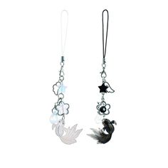 two earrings with charms attached to them on a white background, one is black and the other is silver