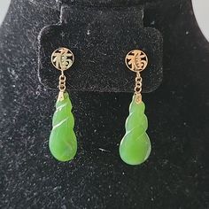 I Couldn't Find The Stamp On These So I Acid-Tested The Gold And They Are 14k. Aren't These Earrings Absolutely Gorgeous? Jade Is A Gemstone That Has Been Used For Centuries For Its Healing Properties. Jade Earrings Are Often Associated With Emotional Balance And Stability, And Are Believed To Help Calm The Mind, Reduce Stress, And Promote Peace And Harmony Length: 1.75" Width: 0.5" Metal Type: 14k Yellow Goldgemstone: Jade Stone Count: 2 Stone Dimensions (Mm): Length 31.24, Width 12.48, Depth 3.36 Stone Shape: Carved Drop Stone Color: Green In The Last 2 Pics, I'm Attempting To Show The Translucency. Yellow Gold Jade Dangle Jewelry, Unique Gold Jade Earrings, Bohemian Gold Jade Earrings, Carved Jade Earrings, Vintage Green Jade Earrings, Calm The Mind, Jade Earrings, Peace And Harmony, Emotional Balance