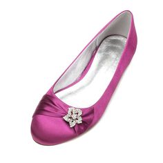 a pair of pink women's shoes with a flower on the heel