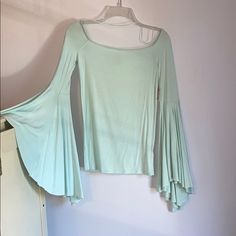 Free People Mint Off The Shoulder Shirt With Wide Flowy Sleeves. Elastic Around The Neckline So It Stays Up. Size Small. Never Been Worn, New With Tags. Stretch Long Sleeve Summer Tops, Summer Stretch Cotton Long Sleeve Top, Stretch Cotton Long Sleeve Top For Summer, Cotton Long Sleeve Summer Top, Light Blue Stretch Blouse For Spring, Green Stretch Long Sleeve Top For Spring, Light Blue Crew Neck Blouse For Spring, Blue Long Sleeve Summer Top, Green Casual Long Sleeve Top For Spring